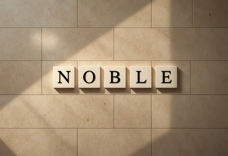 The image features the word "Noble" displayed across beige tiles, showcasing a harmonious blend of elegance and simplicity, enhanced by soft natural shadows.の素材