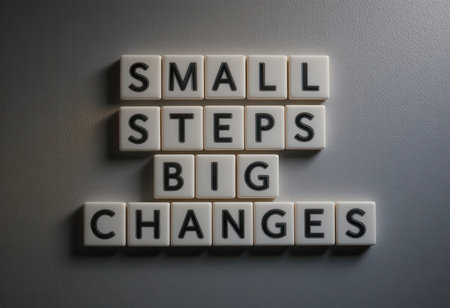 An inspirational arrangement of tiles displaying the phrase "Small Steps Big Changes". This design symbolizes motivation, growth, and transformation in personal and professional journeys.の素材