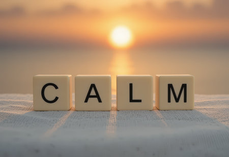 The image features the word "CALM" spelled out with blocks, placed against a serene sunset over the ocean, symbolizing tranquility and relaxation ideal for wellness themes.の素材