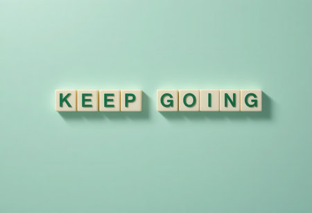 This image showcases the motivational message "Keep Going" on a light green background. Ideal for emphasizing positivity and perseverance in projects and presentations.の素材