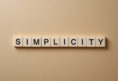 This image showcases the word "Simplicity" created with block letters on a smooth beige surface, embodying minimalism and elegance for various creative projects.の素材