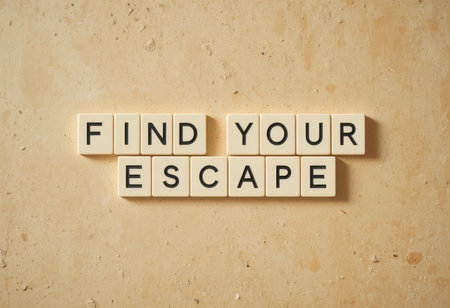 This image showcases the motivational phrase "Find Your Escape" arranged in block letters against a neutral background, symbolizing tranquility and personal growth.の素材