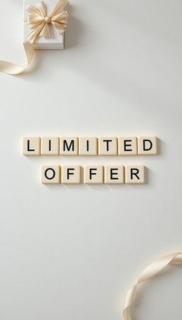 A visually appealing flat lay featuring the words "Limited Offer" arranged in tiles next to a beautifully wrapped gift box, perfect for promotional content.の素材