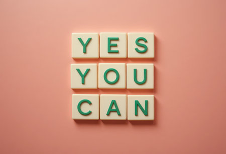 This stock photo features a motivational message spelled out with tiles, creating an uplifting and inspiring visual perfect for home or office decor.の素材
