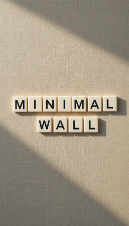 This image features a minimal wall design using letter blocks that spell "MINIMAL WALL." The interplay of shadows and textures adds to its aesthetic appeal.の素材