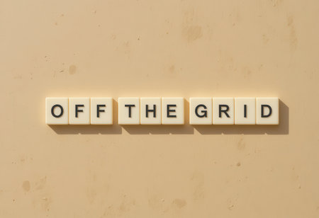 This image features letter tiles arranged to spell "OFF THE GRID" against a neutral background, showcasing a minimalist design perfect for creative projects or inspirational content.の素材