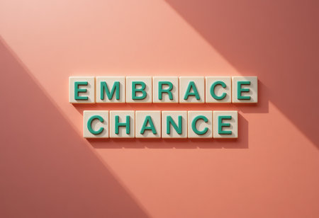 This image features colorful letter tiles spelling "Embrace Chance" against a soft pink background, creating an uplifting and modern design perfect for inspiration.の素材
