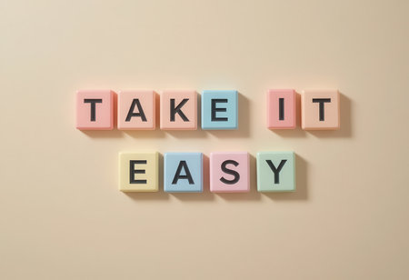 A vibrant arrangement of colorful wooden blocks forming the phrase "Take It Easy." This cheerful design adds a playful touch to any space, promoting relaxation.の素材