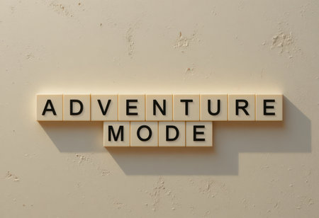 This image features the phrase "Adventure Mode" crafted from letter tiles against a plain background, symbolizing creativity and exploration in various activities.の素材