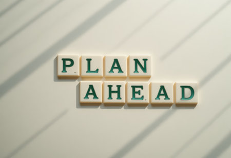 This intriguing image features the phrase "Plan Ahead" arranged with letter tiles, casting soft shadows. Ideal for themes of strategy, organization, and inspiration.の素材