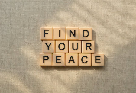 A serene arrangement of letters spelling "Find Your Peace" in soft natural light, perfect for conveying messages of tranquility and mindfulness.の素材