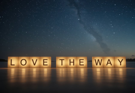 A serene night scene featuring illuminated block letters spelling "LOVE THE WAY" against a starry sky reflecting on calm water, evoking feelings of romance and connection.の素材