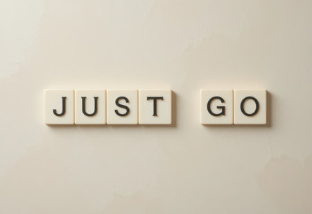 Embrace the power of encouragement with this simple visual featuring tiles spelling "Just Go." Perfect for inspiring motivation and positivity in any space.の素材