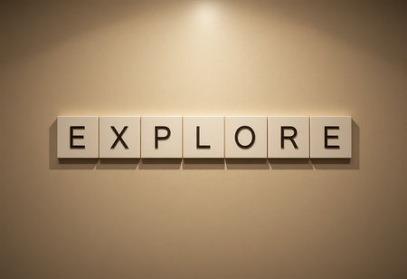 A creative display featuring letters that spell "explore," set against a neutral wall. This minimalistic decor inspires curiosity and a sense of adventure.の素材