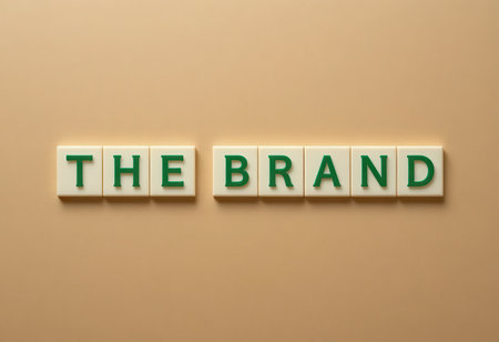 A minimalist flat lay presentation featuring colorful letters forming a brand name against a soft beige background, perfect for marketing and design projects.の素材