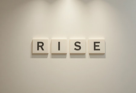 A stylish display featuring the word 'rise' in bold typography on a clean wall. This modern design symbolizes inspiration and positivity, perfect for interiors.の素材