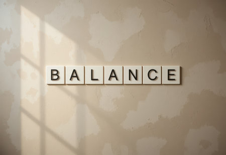 The image showcases the word "BALANCE" arranged with letter tiles on a textured wall, capturing a serene and minimalist aesthetic that promotes harmony and stability.の素材