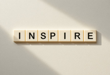 A bright image featuring the word "Inspire" crafted in bold letters against a light, textured background. Perfect for themes of motivation and creativity.の素材