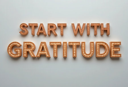 This image features illuminated letters that spell out "Start with Gratitude," perfect for inspiring positivity and motivation in any space.の素材