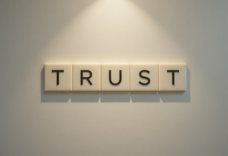 Wall art displaying the word "Trust" in a modern office ambiance highlights the importance of trust in personal and professional relationships.の素材