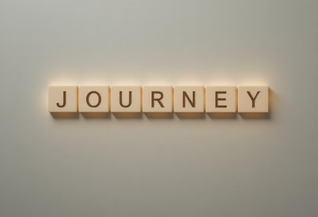 A minimalist display of the word "JOURNEY" crafted with wooden letter blocks, symbolizing exploration and personal growth, perfect for inspirational decor.の素材
