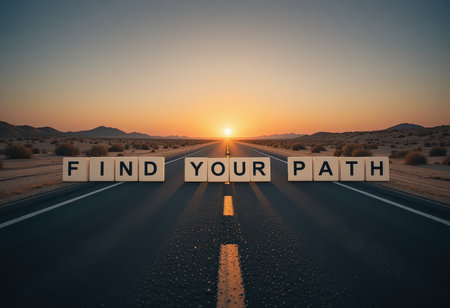 A stunning sunset view of an open road featuring the message "Find Your Path" crafted from bold letters, symbolizing motivation and life's journey ahead.の素材