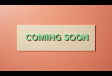 A sleek and modern sign featuring the phrase "Coming Soon" against a coral background. Ideal for promotions, announcements, or event marketing.の素材