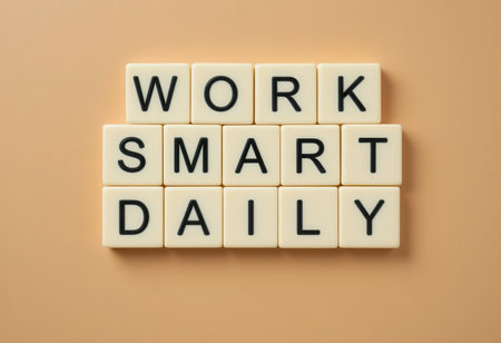 This image features a motivational quote "Work Smart Daily" displayed using letter tiles on a soft neutral background, ideal for conveying inspiration and positivity.の素材