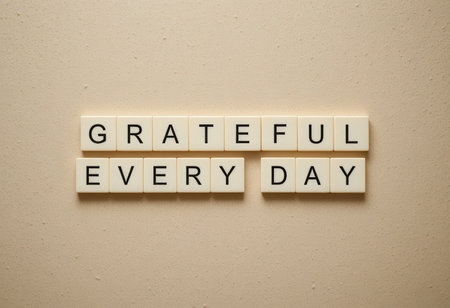 Inspirational image featuring the words "Grateful Every Day" displayed on neutral background, ideal for promoting positivity, affirmation, and wellness themes.の素材