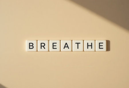 The image features the word "Breathe" displayed on a soft, neutral background. It serves as a gentle reminder to focus on relaxation and mindfulness.の素材