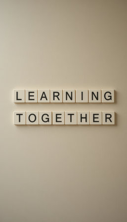 The image features letter blocks arranged on a wall, spelling "Learning Together," symbolizing education, collaboration, and growth in personal or professional spaces.の素材