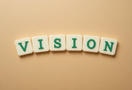 A creative setup displaying colorful letter blocks spelling out "VISION." This image represents clarity, creativity, and the drive to reach future goals and ambitions.の素材