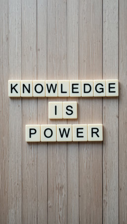 Displaying a powerful message, this image captures the phrase "Knowledge is Power" using letters on wood. Ideal for motivation and inspiration themes.の素材
