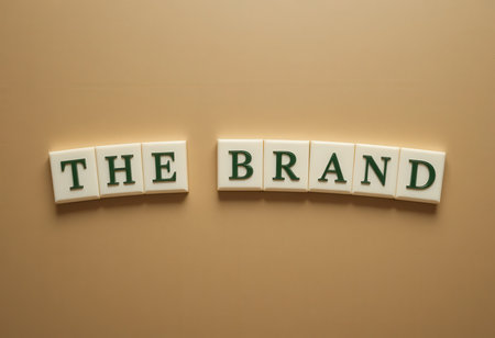 A creative arrangement of the words "The Brand" using elegant letters on a neutral background, perfect for marketing and branding purposes.の素材