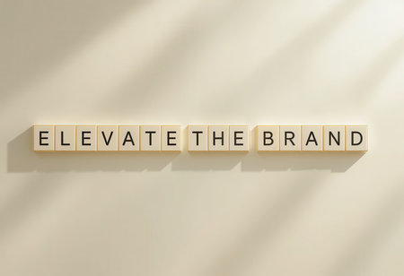 A creative arrangement of letter tiles spelling "elevate the brand" on a clean white background, symbolizing modern marketing and branding strategies.の素材
