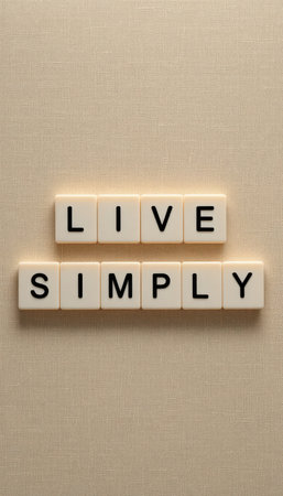 This image features an uplifting message "Live Simply" created with letter tiles, emphasizing minimalism and mindfulness in a peaceful setting.の素材