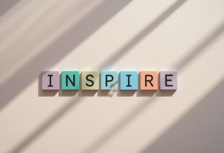 Colorful letters spelling "INSPIRE" create a vibrant message. Soft shadows add depth, perfect for themes of motivation, creativity, and positivity.の素材