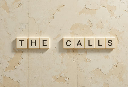 This image features vintage tiles spelling "THE CALLS" on a textured beige wall, perfect for conveying communication themes in design projects or decor.の素材