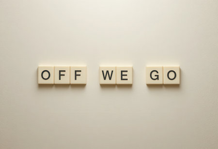 The image features the phrase 'OFF WE GO' represented in a minimalist design style, conveying a sense of adventure and positivity with its clean layout on a white background.の素材