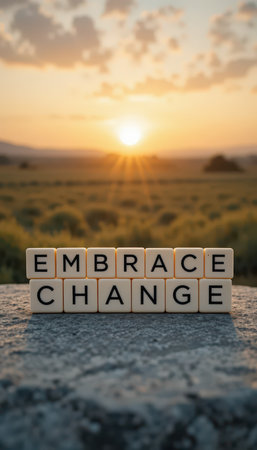 A serene view of a sunset over a green field featuring the words "Embrace Change." This image captures the essence of growth and motivation, perfect for inspiring transformation.の素材