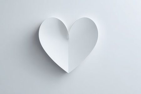 This minimalist heart shape made of paper creates an elegant symbol of love. Ideal for various creative projects, it sparks inspiration with its simple and unique design.の素材
