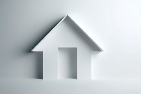 A striking minimalist representation of a house shape in pure white against a soft background, ideal for design and architectural concepts.の素材