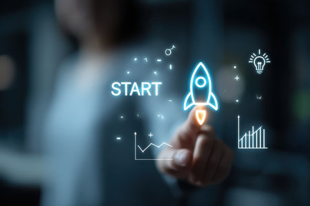 A concept image illustrating a hand touching a digital rocket symbolizing the launch of innovative ideas and successful business growth strategies.の素材