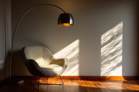 A cozy modern armchair accompanied by an arc floor lamp creates a serene atmosphere in a minimalist interior. Soft shadows and warm tones enhance the inviting space.の素材