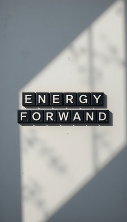 A visually striking representation of the words "Energy Forward" set against a bright background with light and shadows, symbolizing motivation and progress.の素材