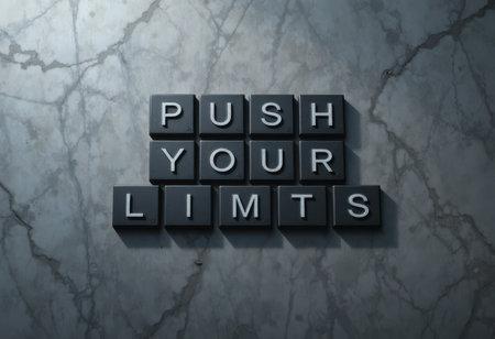 A motivational message arranged with black tiles on a marble background. The phrase "Push Your Limits" inspires determination and encourages personal growth and exploration.の素材