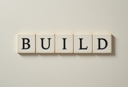 This image features artistic tiles arranged to spell the word "Build," symbolizing creativity and inspiration in construction and education. Perfect for design projects.の素材