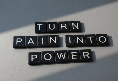 This image features an inspiring quote that encourages individuals to transform their pain into power. It's a motivating reminder for personal growth and resilience.の素材