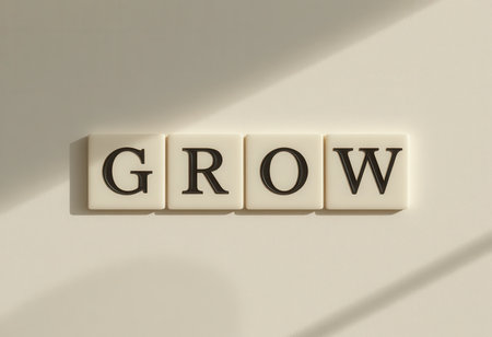 Inspirational word "grow" displayed in a minimalist style, symbolizing growth and positivity. Perfect for decor in a home or office space.の素材