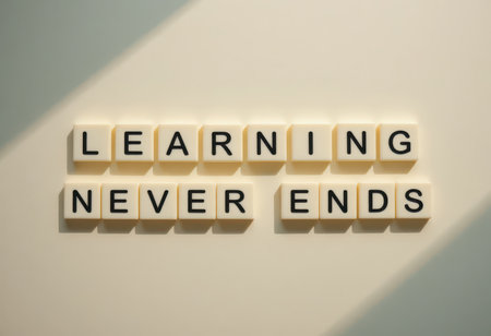 A modern wall art piece featuring the inspiring quote "Learning Never Ends" made of letter tiles. A perfect visual for education, motivation, and personal growth themes.の素材